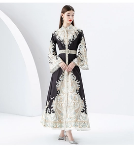 Detailed close-up of paisley print and flared sleeves on this elegant black maxi dress