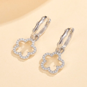 Detailed macro view of S925 silver flower earrings with micro-set sparkling white zircons