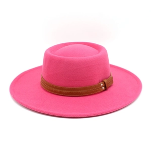 Detail of rose red wool boater hat with double-layered brown leather buckle belt trim