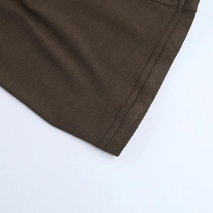 Detailed close-up of double-stitched hem on dark brown knit fabric showing textile texture