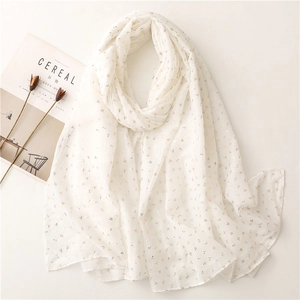 Elegant white shawl scarf with gold foil leaf patterns and soft cotton-linen texture