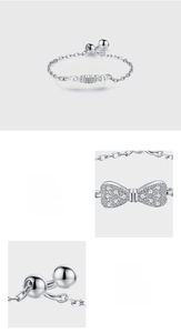 Detail of 925 sterling silver bow ring featuring hand-set 5A pink and white zircons