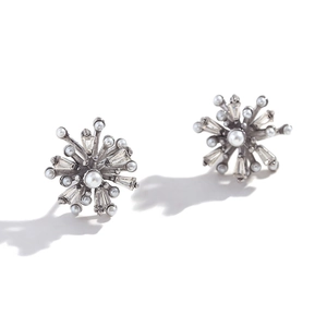 Silver snowflake earrings with white pearls and rectangular crystals on white background