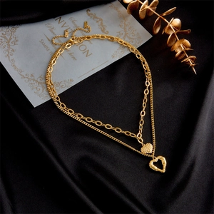 Double-layer titanium steel angel wing heart necklace with gold finish on black silk