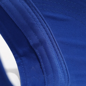 Close-up of royal blue visor brim with professional multi-row reinforced stitching details