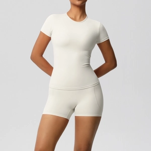 Close-up of cream white slim fit yoga set showing breathable fabric texture and high elasticity