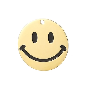 Close-up of a polished gold-finish smiley face pendant made of stainless steel