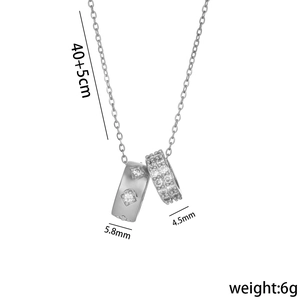 Silver titanium steel necklace with double ring rhinestone pendant on white background