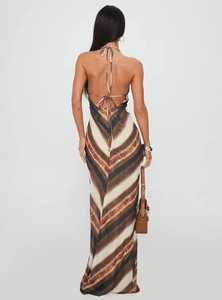 Detail of the tie-dye pattern and back lace-up straps on a backless V-neck maxi dress