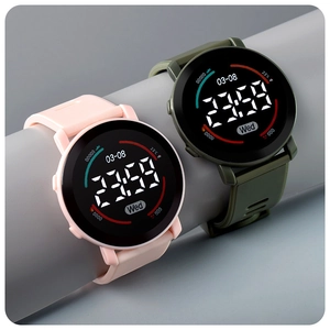 Detail of pink and olive green digital sports watches with silicone bands on round props