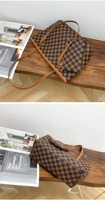Detailed view of vintage checkered tote bag with matching pouch on a wooden bench