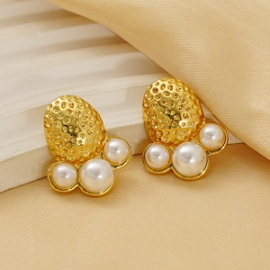 Elegant gold plated hammered texture earrings with pearls on champagne silk fabric