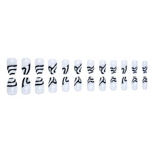 Long coffin fake nails with black and white zebra wavy lines and glossy finish