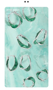 Detail view of S925 sterling silver hoop earrings with green marble texture enamel