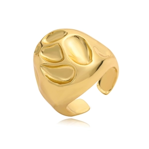 Macro view of wide gold-plated ring with organic hammered texture and lava pattern