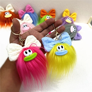 Portachiavi mostro in peluche colorato con fiocco, ciondolo per zaino carino e bizzarro