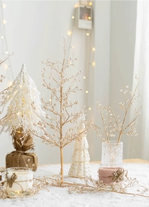 Close-up of champagne gold berry branch with crystal beads for Christmas decor