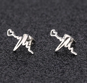 Macro shot of silver heartbeat pulse earrings with polished stainless steel finish