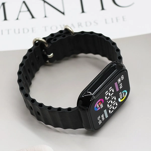 Close-up of black sports LED watch with wavy silicone strap and digital dial interface