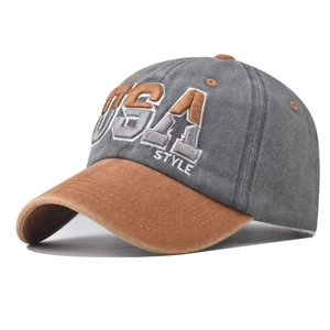 Detailed close-up of embroidered USA logo on vintage washed cotton baseball cap