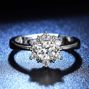 Macro shot of snowflake design silver ring with brilliant-cut stone and pavé setting