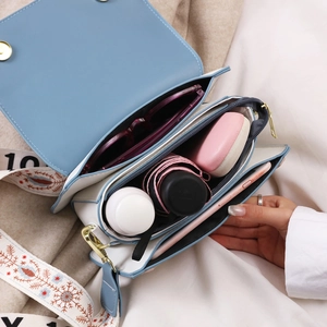 Blue and white leather crossbody bag with spacious compartments for daily essentials