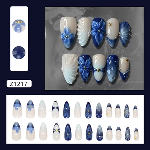 Handmade 3D floral press-on nails in navy blue and white with pearls and stripe details