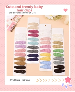 Close-up of assorted floral fabric BB hair clips with textured embroidery on display cards