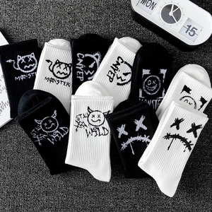 Black and white street graffiti mid-calf socks with monster print and rib-knit texture