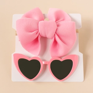 Pink bow nylon headband and heart-shaped sunglasses set for infants on display card