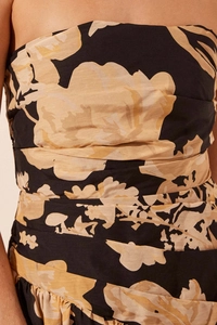 Detail of vintage floral print swimsuit with ruched fabric texture and waist draping