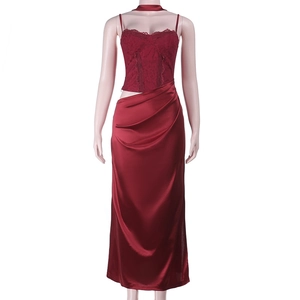 Close-up of wine red lace top and satin slit skirt for French style evening dress