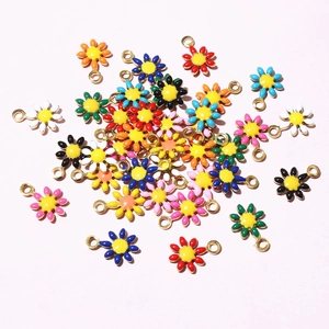 Macro view of colorful stainless steel flower pendants for DIY jewelry making