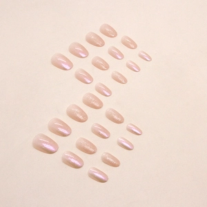 Pink aurora glitter oval false nails set displayed neatly on a neutral background