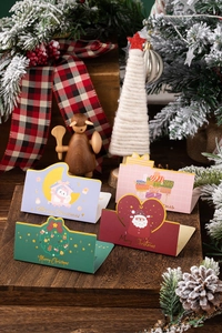 Detail of four creative 3D pop-up Christmas cards featuring snowman and santa designs
