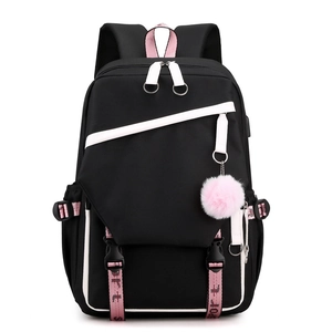 Minimalist black student backpack with pink accents and plush pendant on white background