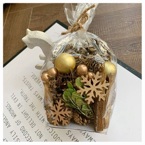 DIY Christmas set with gold balls, pine cones, and wood flakes in rustic gift packaging
