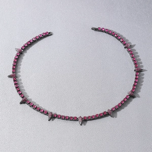 Detail of pink crystal rhinestones on black spiked choker necklace for men