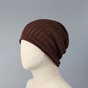 Detailed knit texture of a lightweight breathable brown slouchy beanie with colorful dots