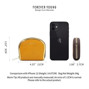 Yellow faux crocodile leather coin purse with dimensions and iPhone scale reference