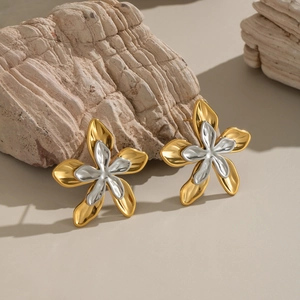 Two-tone silver and 18K gold stainless steel flower stud earrings on stone props