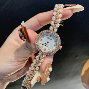 Elegant ladies quartz watch with round shell dial and pearl bracelet with sparkling crystals