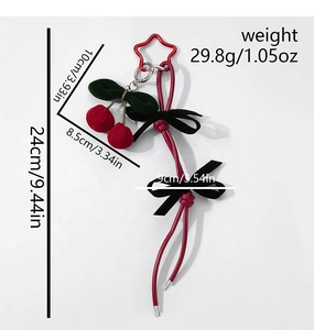 Detailed view of woven cherry keychain with dimensions 24cm total length and 29.8g weight