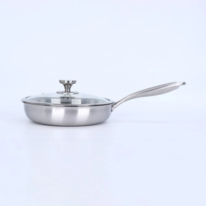 Detailed view of professional 3-ply stainless steel frying pan with clear glass lid