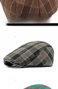 Close-up of adjustable metal buckle on plaid newsboy hats in various colors