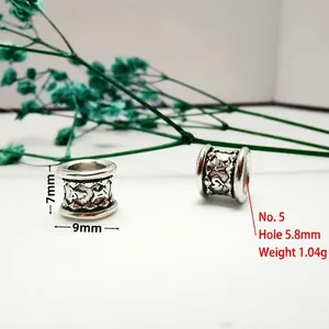 Detailed view of 9mm antique silver spacer bead with 5.8mm large hole and ethnic relief