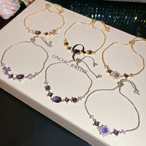 Detail of adjustable purple zircon flower bracelets on jewelry box display