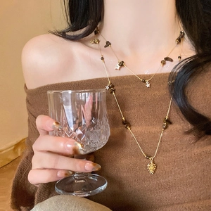 Vintage tiger eye beaded double-layer necklace with star pendant on model