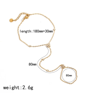 Gold stainless steel flower hand chain bracelet with zircon stones and sizing details
