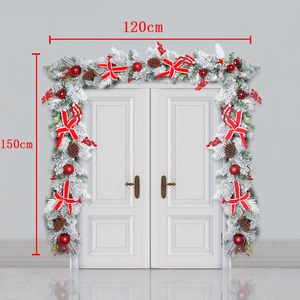 Detail showing 120cm large Christmas wreath with red bow and berries on white doors